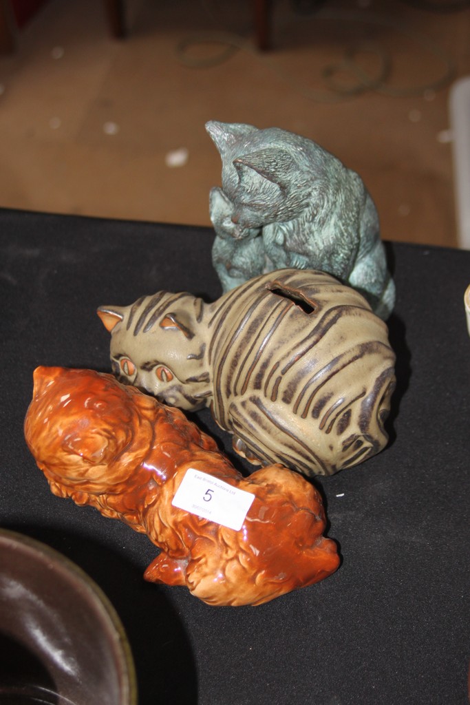 A collection of pottery cat figurines ( see illustration )