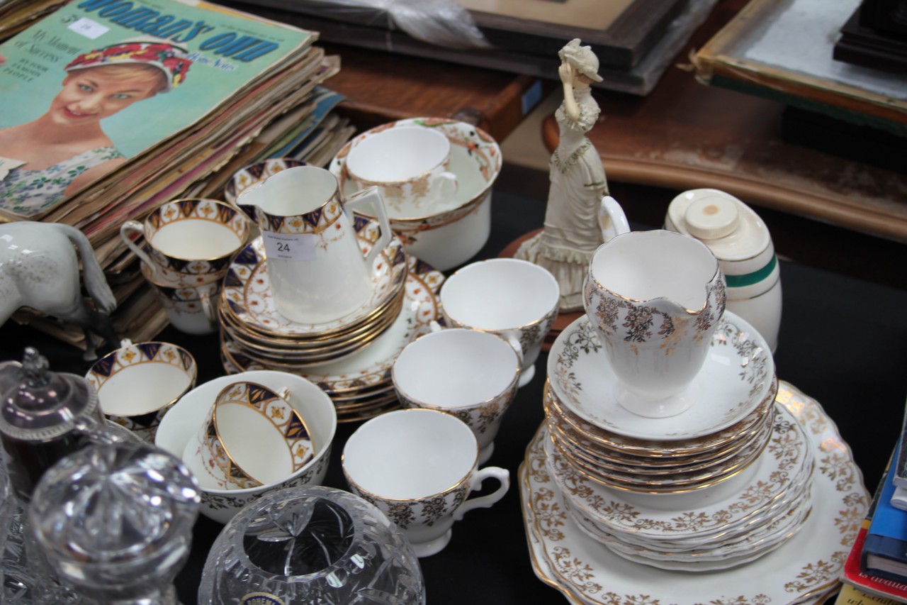 A 19th century Chinese Imari part tea service together with another part tea service having gilded