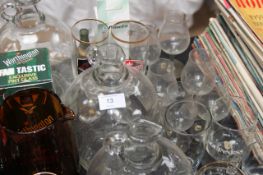 A large collection of pub related glassware to include demi-johns and other items ( exc copper