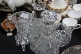 A collection of cut glass items to include Bohemia, Decanters etc