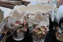 A 20th century Staffordshire china vase garniture having embellished flowers