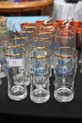 A collection of vintage pub glasses - Harp Lager pint glasses