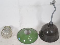 A collection of vintage 20th century Industrial mixed lights  and enamel shades