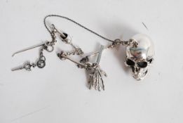 A Victorian style white metal / silver (stamped 925) scull and bones fob watch chain and key.