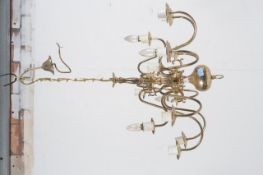An antique style brass effect rococo 12 branch chandelier complete with sconces