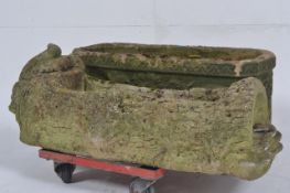 A good 20th century rectangular garden planter cast in relief with scrolls and central lion mask to