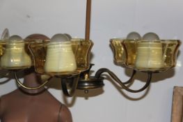 A brass retro 1950`s chandelier complete with the glass shades