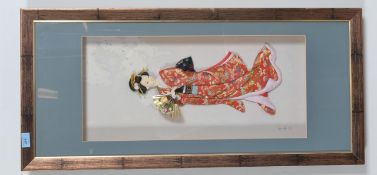 A decorative Japanese framed Geisha doll set behind glass. Measures: 60cms H x 28cms W.