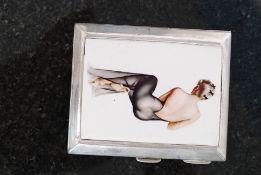A silver Birmingham 1927 cigarette case with art deco pictorial of a lady in a see through dress