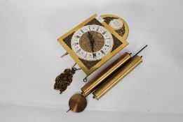 A vintage Tempus Fugit brass clock movement