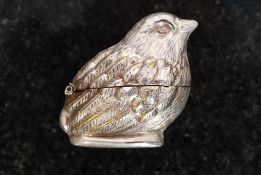 A silver plated vesta in the form of a bird, with hinged body.