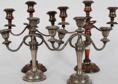 2 pair of early 20th century 3 branch candelabra all being raised on terraced bases having 3