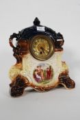 An early 20th century Staffordshire mantel clock with gilt face having classical painted finish.