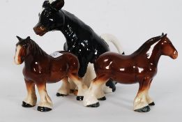 A pair of Melba shirehorses along with a novelty Enesco cow milk jug