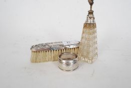 A silver hallmarked sterling silver napkin ring with hallmarked topped sprayer bottle and white