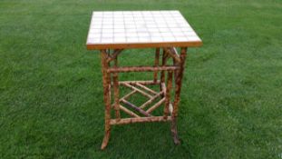 A Victorian aesthetic movement bamboo occasional table circa 1890 having decorative frame with later