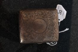 A hallmarked silver cigarette case by Kemp Bros, Birmingham 1911 being rococo chase decorated having