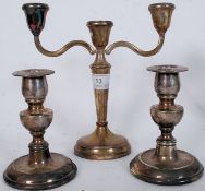 A hallmarked silver 3 sconce candlestick raised on terraced base with a good pair of silver plated