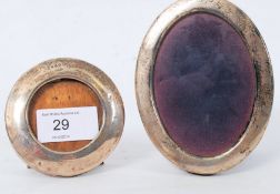 2 hallmarked silver oval picture frames, one large, one small. Hallmarks for London 1918 to the