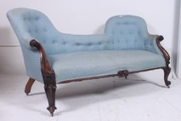 A good Victorian solid rosewood double scroll end sofa settee being raised on shaped supports with