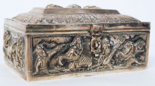 An Indian silver white metal highly decorated casket box decorated in relief with scenes of deity
