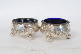 A pair of 19th century Victorian hallmarked silver salts complete with the blue glass liners