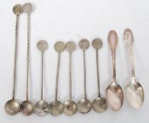A set of 7 silver metal twizzle spoons along with 2 others with continental marks. Weight 119 grams