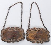 A pair of silver hallmarked decanter labels for Sherry & Port. Hallmarks for 1968, Birmingham.