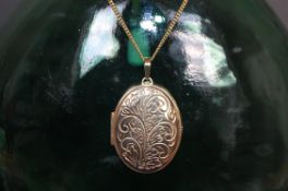 9ct gold large engraved locket on chain. weight 15.9g