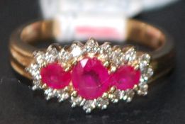 9ct gold ruby and diamond boat shaped cluster ring. Size N. weight 3.5g