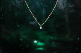 9ct gold chain with .10ct diamond drop pendant 16 inches long