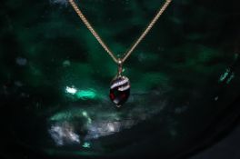 9ct gold 5point diamond and garnet drop pendant on 9ct gold chain measures 18 inches