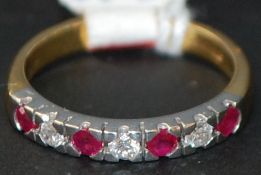 18 ct gold ruby and diamond half eternity ring. Size O.5. Weight 4g