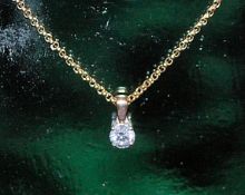 9ct gold chain with .20ct diamond drop pendant measures 16 inches.