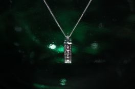 9ct white gold diamond and pink saphire pendant on a 9ct white gold chain 18 inch.