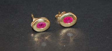 18ct gold oval ruby stud earings