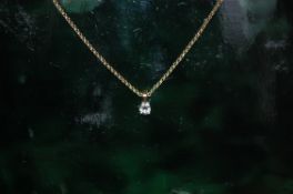 9ct gold chain with .15ct diamond drop pendant 16 inches long.