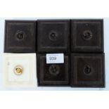 A collection of early 20th century original bakelite switches to include 5 brown examples and one