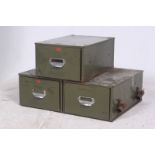 An early  20th century modular set of Industrial 3 green drawer table top metal filing cabinets by
