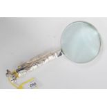 An unusual 20th century silver plated magnifying glass in the form of a bag of golf clubs to the