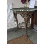 A 19th century shabby chic cast iron pub table having mahogany top being painted