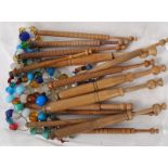 A small collection of lace bobbins all with glass beads
