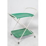 A 1970's tubular metal and green plastic two tier serving trolley raised on the original castors.
