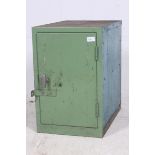 A  20th century metal Industrial locker in green having full length doors with shelved interior.