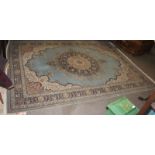 A large 20th century rug having blue ground with decorative geometric patter nation