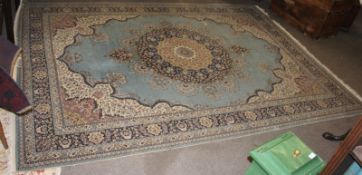 A large 20th century rug having blue ground with decorative geometric patter nation