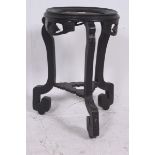 A 19th century Chinese hardwood antique ebonised plant stand raised on shaped supports complete with