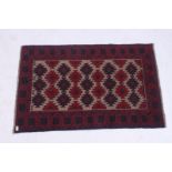 A handwoven Kazak prayer Rug having central diamond lozenges / motifs with red and blue