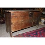 A good 17th century possibly West Country, English boarded Oak Coffer chest. The hinged top with