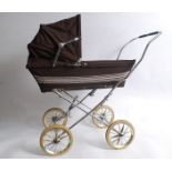 A vintage Silvercross brown childs pram with original hood, mat and wheels etc.